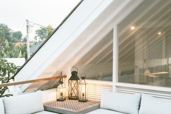 Loft conversion under a sloped ceiling with a roof window, showing typical eaves head height